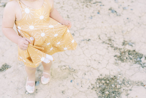 Tie top little girls twirl dress with modern suns