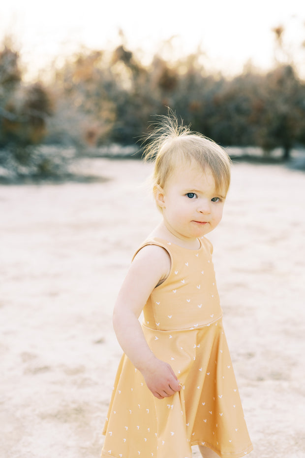 Modern hearts toddler twirl dress in mustard