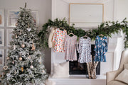 Coordinating Christmas twirl dresses in navy blue and blush pink and a cheery watercolor floral and gingham